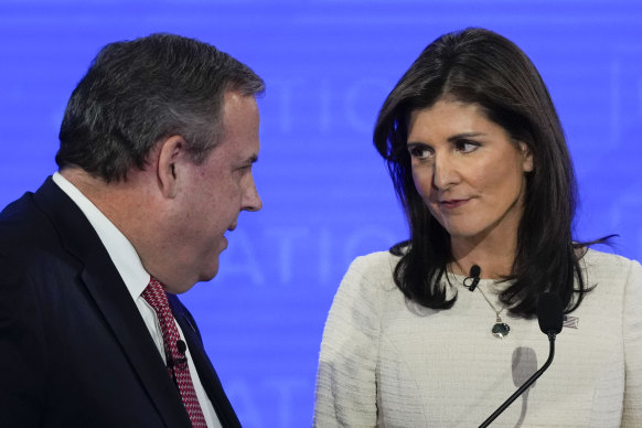 Republican presidential candidate Chris Christie debates with Nikki Haley.