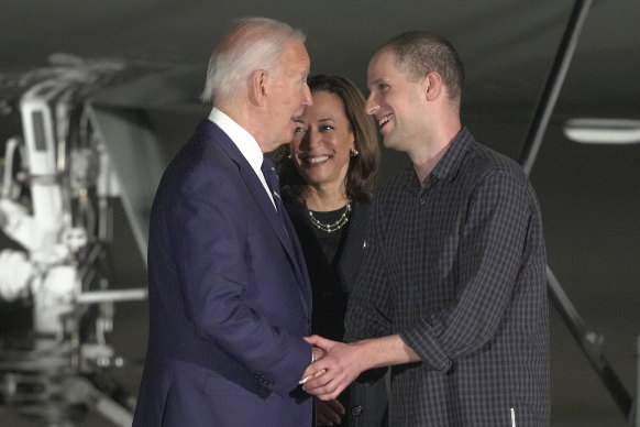 US President Joe Biden and Vice President Kamala Harris greet reporter Evan Gershkovich at Andrews Air Force Base on Friday (AEST).