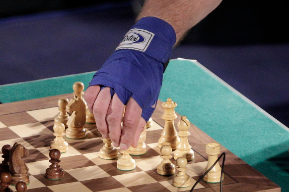 A player makes his move during a bout of chessboxing.