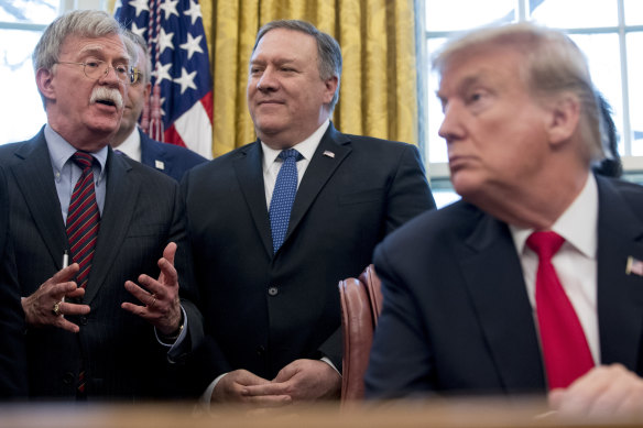 John Bolton (left) with Donald Trump and then-secretary of state Mike Pompeo in 2019.
