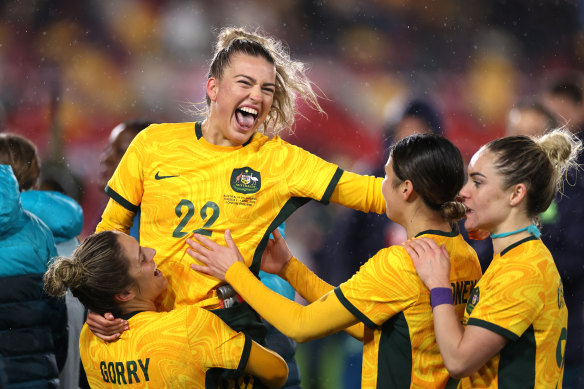 Charlie Grant celebrates with her team after the 2-0 victory over the Lionesses.