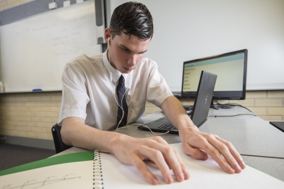 Connor sits in his exam room with a supervisor and takes rest breaks during the hours-long HSC tests.