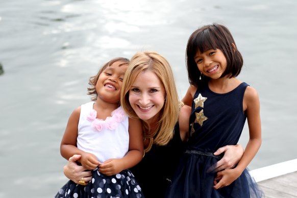 Sarah with Sophea, right, and Jasmine, the girl she and her husband Ben welcomed into their family.  