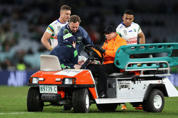 Corey Harawira-Naera in the hands of medical staff after suffering a seizure at Accor Stadium last year.