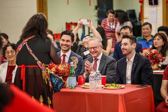 Gabriel Ng and the PM take part in the festivities on the third day of the two-week-long celebration. 