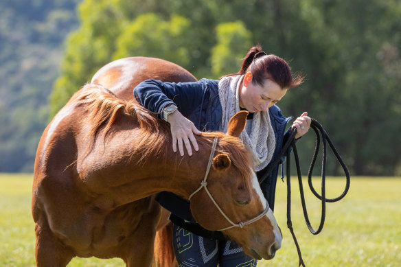 Annette Demosthenous with Jack, an equine therapy horse at Gwinganna Lifestyle Retreat in Tallebudgera Valley. 
