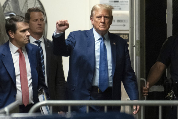 Former president Donald Trump walks to the courtroom in Manhattan.