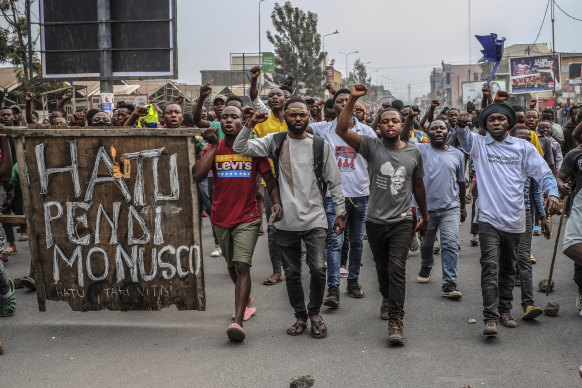 Demonstrators said they were protesting against the rise of insecurity and inaction of the UN in the region. The sign left reads: “Monusco no more”.