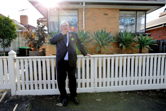 Clive Palmer outside his old childhood home on the election trail in 2013.