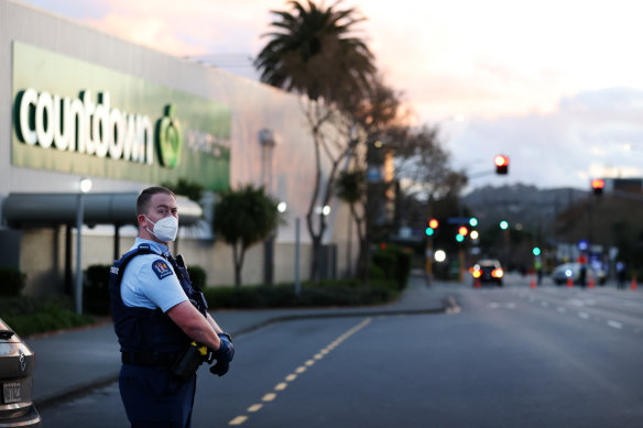 Police guard the area around the New Lynn mall where the terror attack took place.