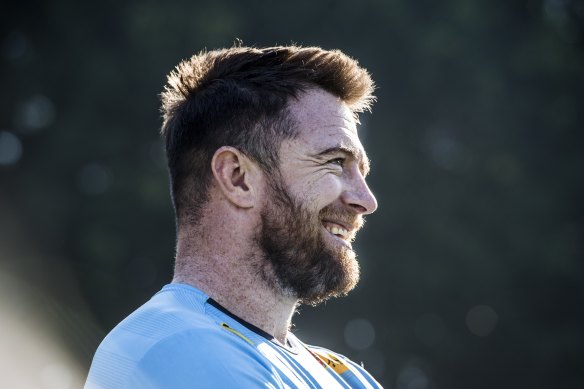 Jed Holloway laughing with Waratahs teammates at Leichhardt Oval on Friday.