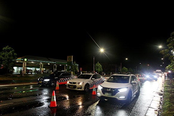 Cars make their way along Wodonga Place as the border checkpoint at South Albury is reopened.