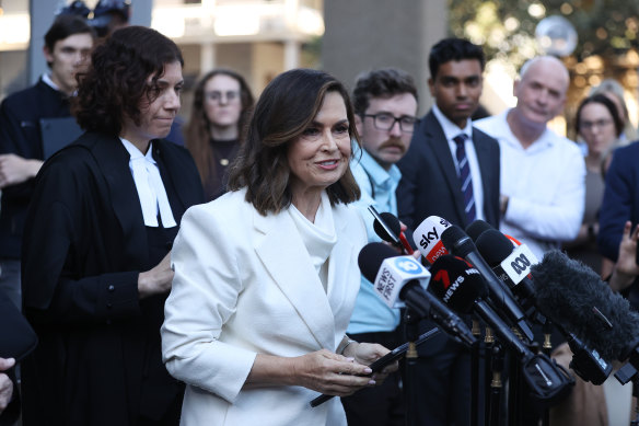 Lisa Wilkinson makes a short statement after emerging from court.