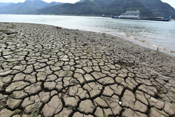 A dried riverbed is exposed after the water level dropped in the Yangtze River in Yunyang county.