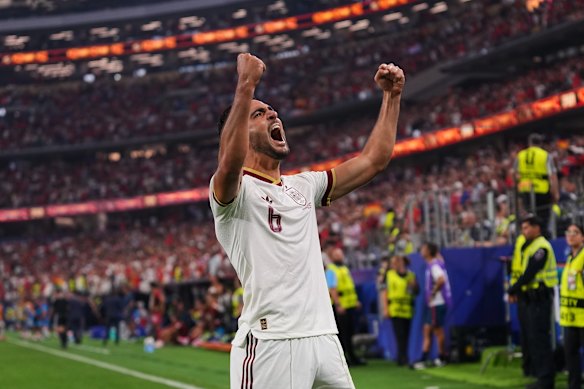 Mikel Merino celebrates his goal for Spain.