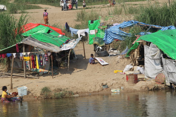 Villagers camp on the banks of the Moei river in Myanmar near the Thai border city of Mae Sot.