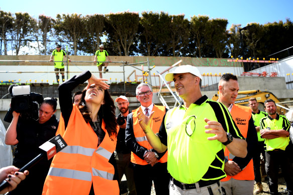 New Zealand Prime Minister Jacinda Ardern meets with builders and construction workers in October 2020.