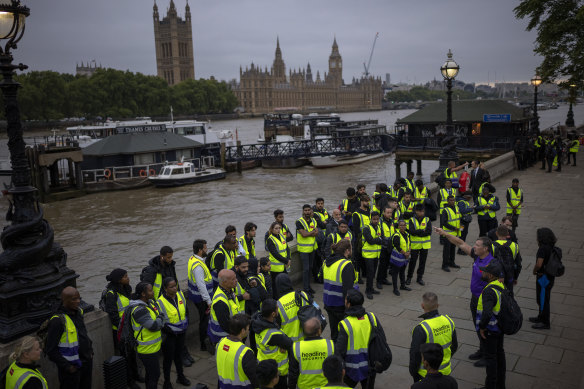Security workers wait to be deployed around central London.