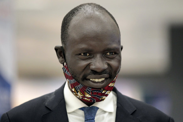 Peter Biar Ajak smiles before giving an interview upon his arrival at Washington Dulles International Airport in Chantilly, Virginia.