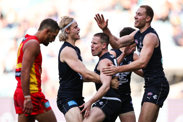 Matt Owies and the Blues celebrate a goal.