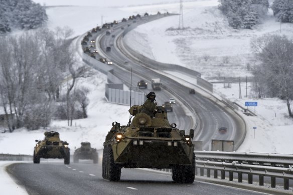A convoy of Russian armoured vehicles moves along a highway in Crimea on January 18. 