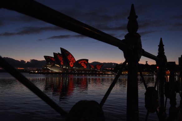 Poppies are projected on the sails of the Opera House for Remembrance Day this morning.