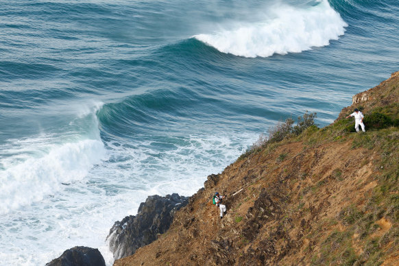Police abseilers conducting the final physical search for Theo Hayez before efforts were suspended.