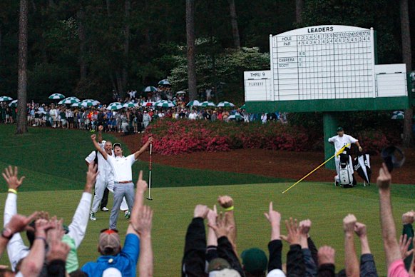 Adam Scott celebrates after holing the winning putt at Augusta in 2013.