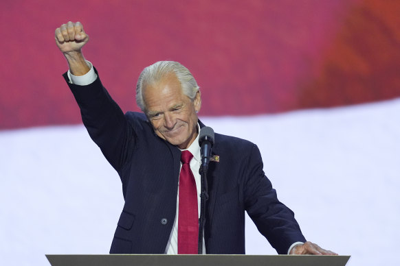 Peter Navarro raises his fist while speaking at the Republican National Convention, hours after he was freed from prison.