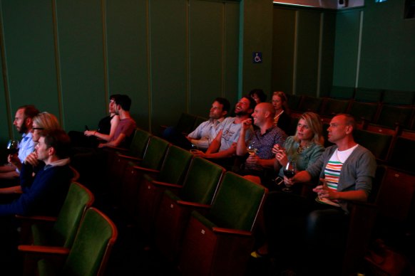 The screening room at Golden Age Cinema has 56 plush velvet seats.