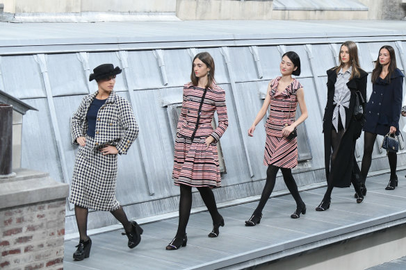 French comedian Marie Benoliel aka 'Marie S’Infiltre' (L) walks the runway during the Chanel Womenswear Spring/Summer 2020 show as part of Paris Fashion Week on October 1, 2019 in Paris, France. 