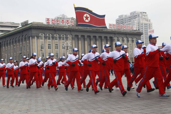 Government officials take part in the first official "sports day" of the new year at Kim Il-sung Square in Pyongyang.