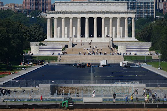 The Reflecting Pool outside the Lincoln Memorial remains drained and fenced off to visitors.