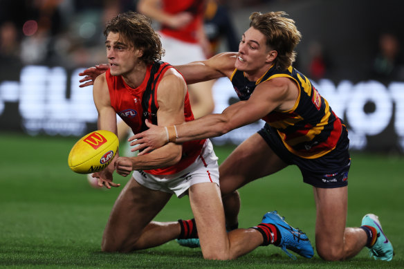 Bomber Harrison Jones, who is tackled by Josh Worrell, kicked the first goal of the night.