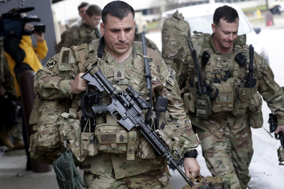 US soldiers at Fort Bragg military base prepare to be deployed to the Middle East.