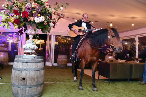 Matt Handbury arrives in style and serenades guests at his 70th birthday celebrations last Saturday night at the Murdoch family estate Cruden Farm in Melbourne.
