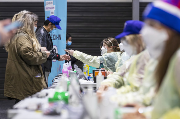 People check in at a vaccination hub at Whitten Oval in Melbourne on October 2.