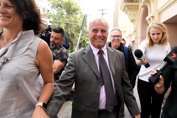 Former Reverend Ron Brookman (centre) leaves Newtown Court on Tuesday morning with his wife Ruth Brookman (left).