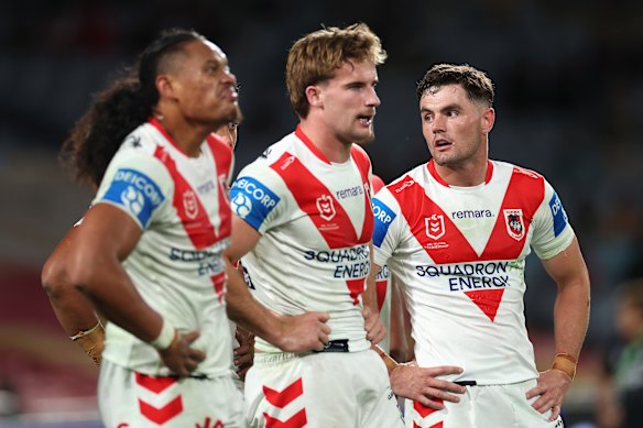 Kyle Flanagan of the Dragons and his teammates look dejected during the match against the Rabbitohs.