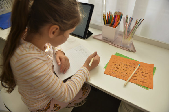 Evie Macheda, 5, starts remote learning at home on the first day of term two.