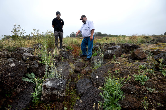 Tyson Lovett-Murray (left) and Denis Rose at a yereroc (fish trap) at Tyrendarra, near Budj Bim, in 2015.