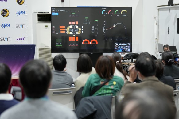 Journalists watching a livestream of the moon landing operation by the Smart Lander for Investigating Moon (SLIM) spacecraft.