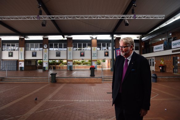 Greg Whitby, executive director of Catholic Education Diocese of Parramatta, stands in the  emptied quadrangle at St Patrick’s Marist College in Dundas.