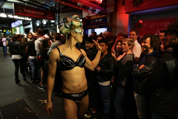 Crowds line up and await the arrival of Lady Gaga at the entrance to the Nevermind nightclub in 2011.