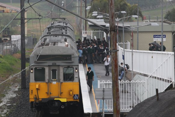 James Ruse Agricultural High School  students board the train at Carlingford Station, on Tuesday August 10, 2010.