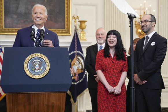 President Joe Biden, left, delivers remarks on a prisoner swap. Standing beside Biden are Mikhail Gershkovich and Danielle Gershkovich.