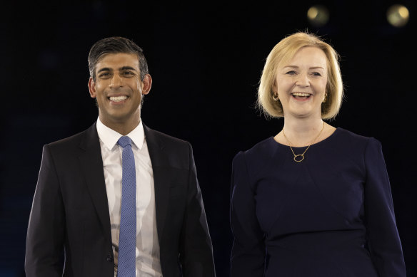 All smiles... Rishi Sunak and Liz Truss at the final hustings of the seven-week grassroots campaign.