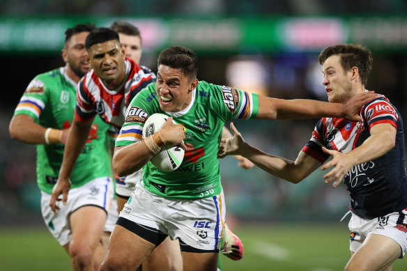 Joseph Tapine brushes Luke Keary aside on his way to the try line.