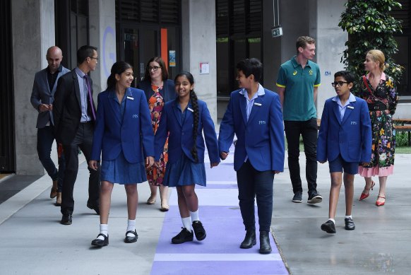 Parramatta Public School students with Minister Sarah Mitchell and the education department's maths ambassadors: math teacher Eddie Woo, Olympian Steven Solomon and former editor of Harpers Bazaar, Kellie Hush.