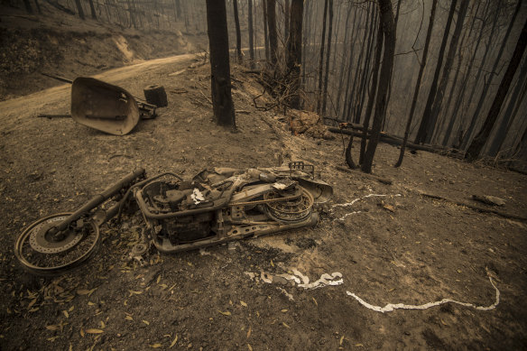 "Bang - it got me:" The motorcycle Roy Annesley was riding in Taylors Arm near Macksville when he was overcome by flames. The photograph was taken by the Herald three days after the fire.